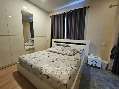 Cozy bedroom with modern decor and ample storage space
