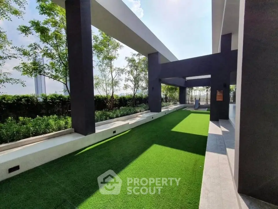 Modern outdoor garden area with sleek architectural design and lush greenery