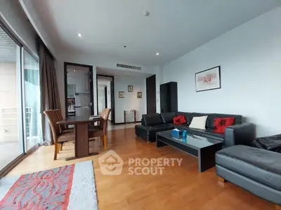Spacious modern living room with elegant decor and balcony access