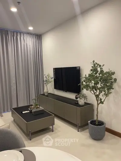 Modern living room with sleek TV setup and elegant decor