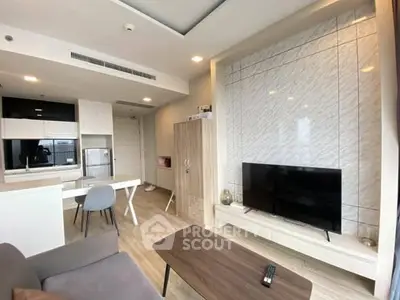 Modern living room with open kitchen and stylish decor