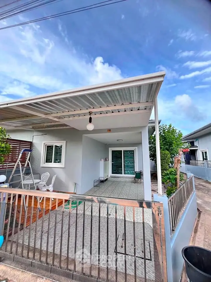 Charming single-story home with covered patio and modern exterior design in a serene neighborhood.