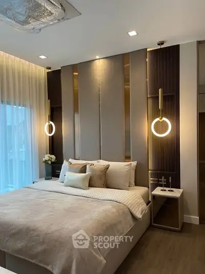 Luxurious bedroom with modern lighting and elegant decor, perfect for relaxation.