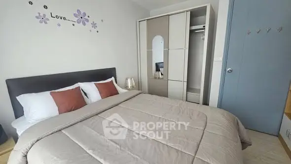 Cozy bedroom with modern decor and ample storage space