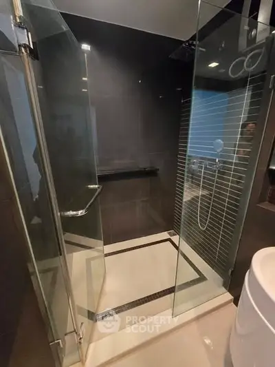 Modern bathroom with glass shower enclosure and sleek design