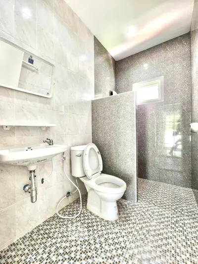 Modern bathroom with sleek design and mosaic tile flooring