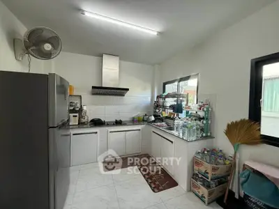 Modern kitchen with sleek appliances and ample storage space