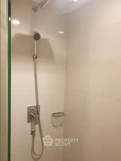 Modern bathroom shower with sleek fixtures and tiled walls