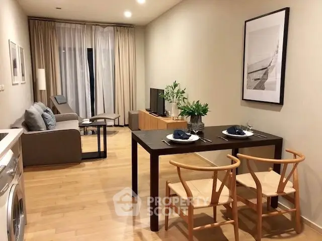 Modern living room with dining area, featuring stylish furniture and elegant decor.