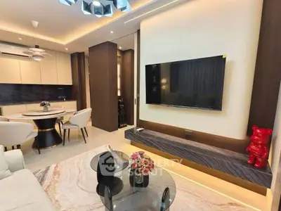Modern living room with stylish decor and open kitchen layout