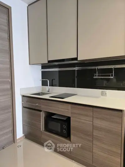 Modern kitchen with sleek cabinetry and built-in appliances