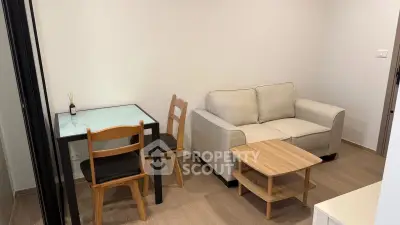 Cozy living room with modern furniture and wooden flooring in a stylish apartment.