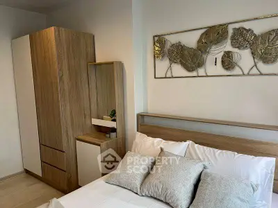 Modern bedroom with stylish wooden furniture and elegant wall art