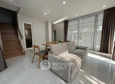 Spacious living room with modern furniture and natural light