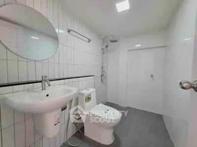 Modern bathroom with sleek fixtures and spacious shower area