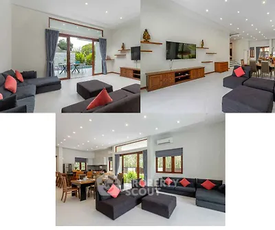 Spacious modern living room with elegant decor and large windows for natural light.