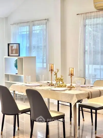 Elegant dining area with modern decor and natural light