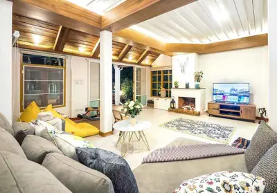 Spacious and elegant living room with modern decor and cozy fireplace
