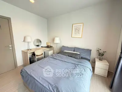 Modern bedroom with stylish decor and cozy ambiance, featuring a comfortable bed and elegant furnishings.