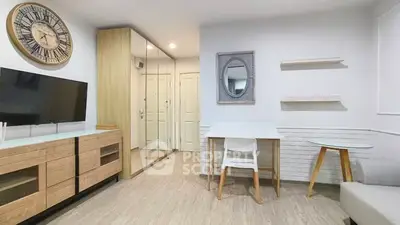 Modern living room with stylish decor and mirrored closet doors