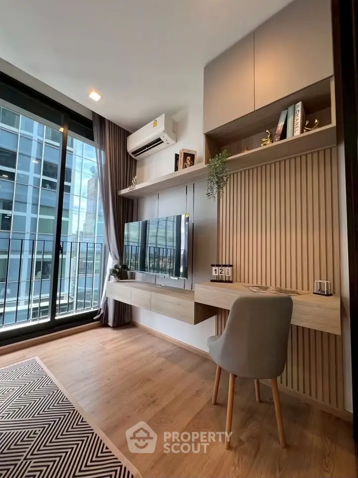 Modern living room with sleek furniture and city view from large windows