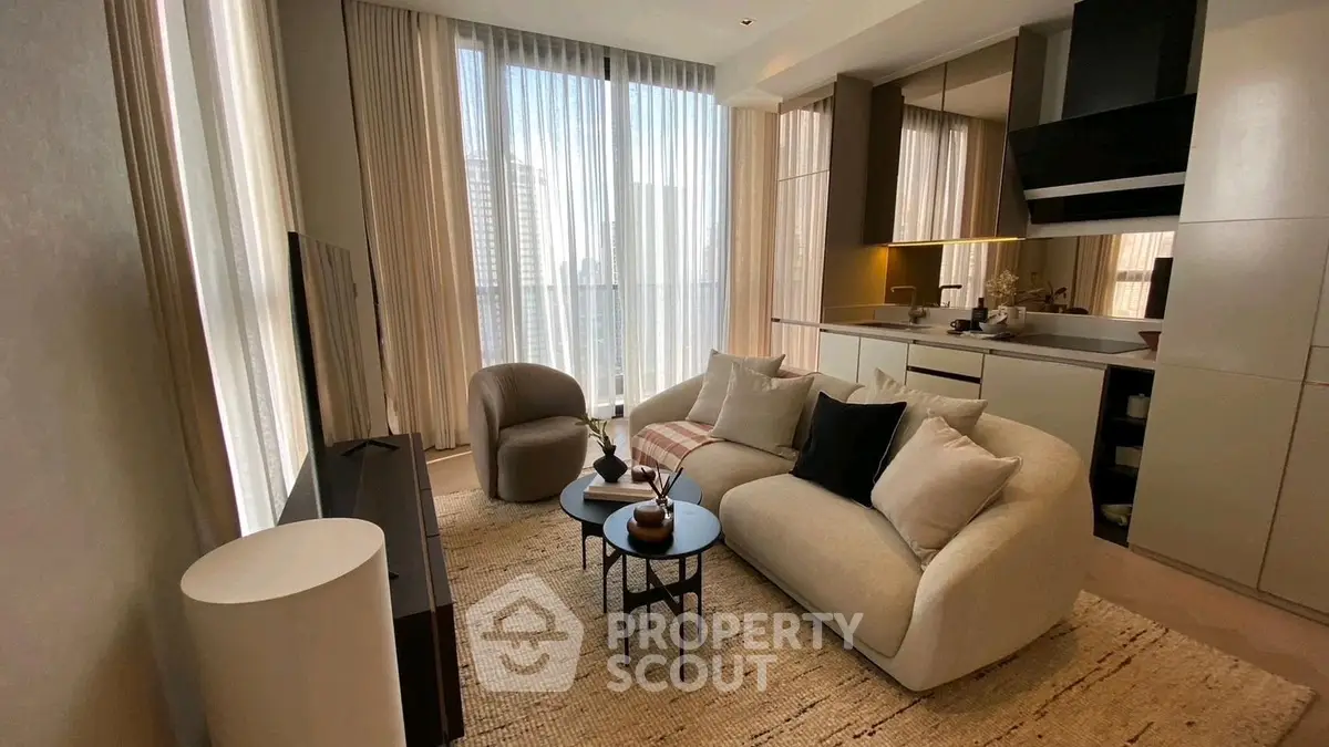 Modern living room with elegant decor and city view, featuring cozy seating and stylish furniture.