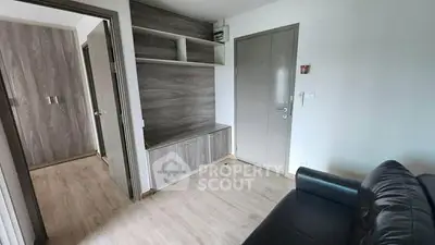 Modern apartment interior with sleek wooden finishes and cozy living area.