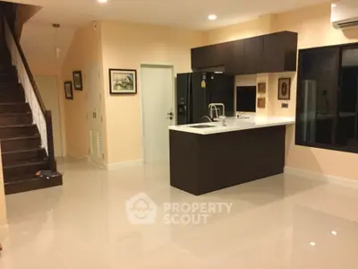Modern kitchen with sleek cabinetry and island in open layout