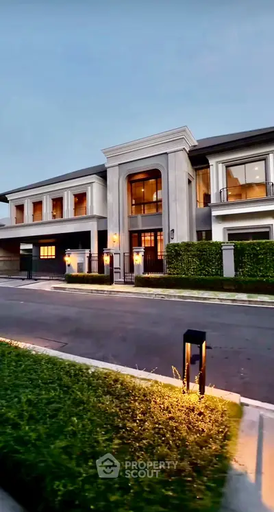 Luxurious modern mansion with elegant facade and lush landscaping, perfect for upscale living.