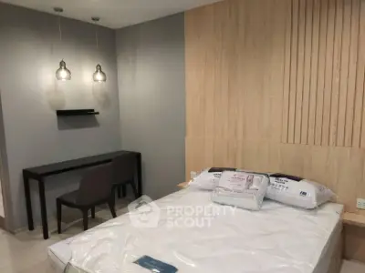 Modern bedroom with stylish lighting and wooden accent wall