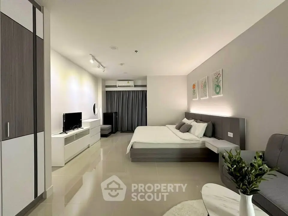 Modern studio apartment with sleek design and cozy furnishings