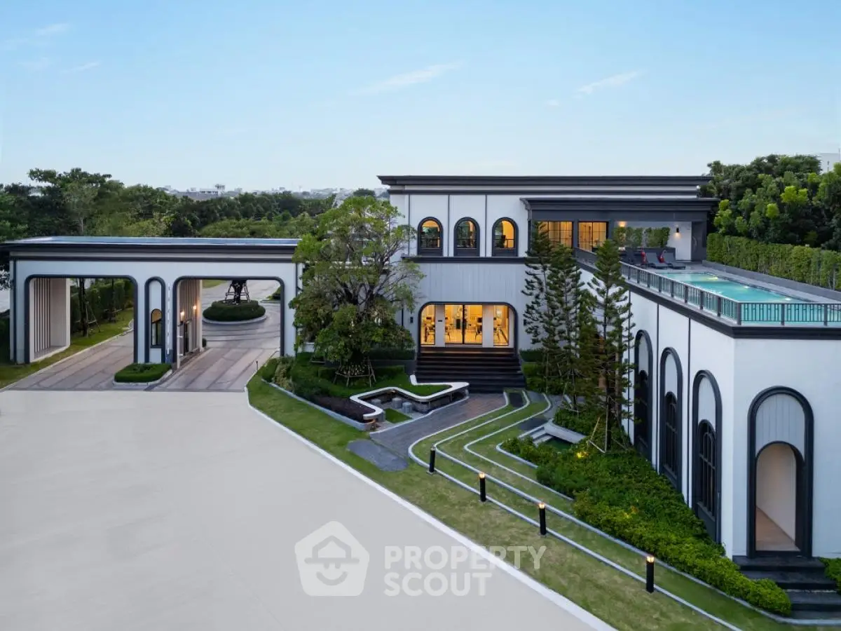 Luxurious modern mansion with rooftop pool and elegant landscaping