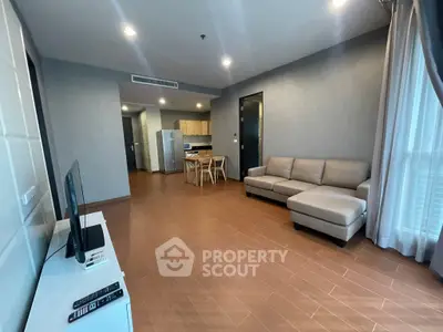 Spacious modern living room with open kitchen and stylish furniture