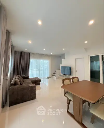 Spacious living room with modern furniture and natural light