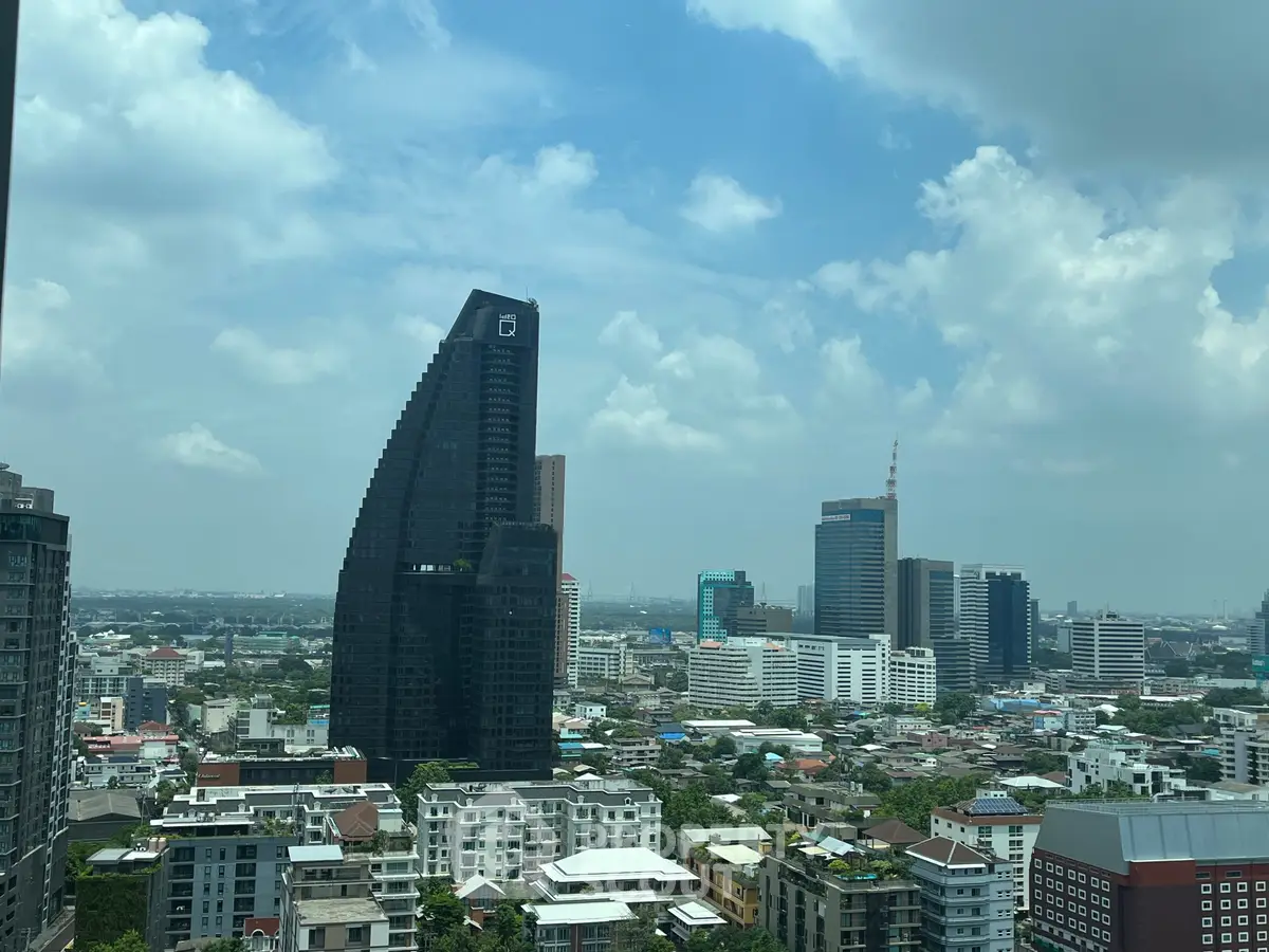 Stunning cityscape view with modern skyscrapers and blue sky, perfect for urban living enthusiasts.
