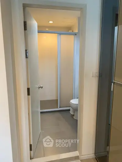 Modern bathroom with sleek shower and neutral tones