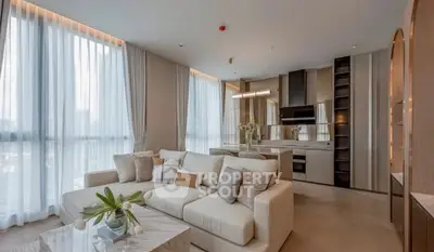 Luxurious modern living room with open kitchen and elegant decor