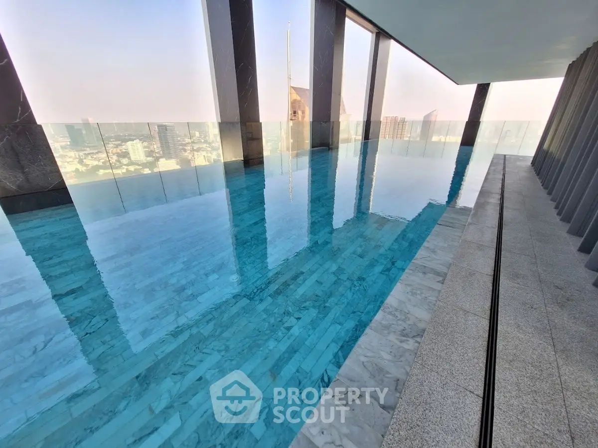 Luxurious rooftop infinity pool with stunning city skyline views