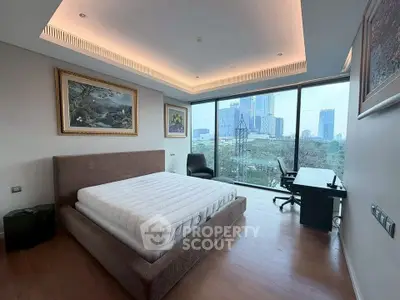 Luxurious bedroom with stunning city view and modern decor
