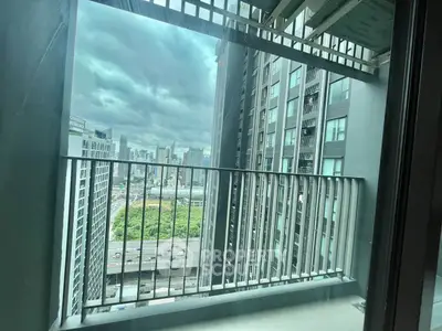 Stunning city view from modern high-rise balcony with sleek railing design.