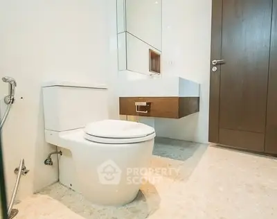 Modern bathroom with sleek fixtures and floating vanity in a contemporary home.