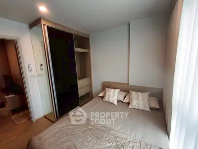 Cozy bedroom with modern design and ample natural light