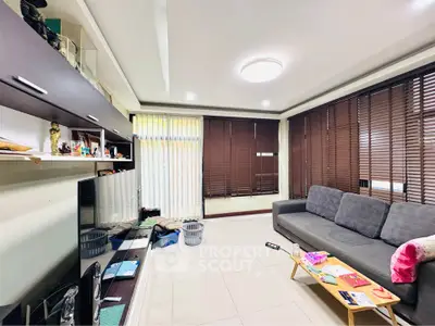 Spacious living room with modern decor and ample natural light