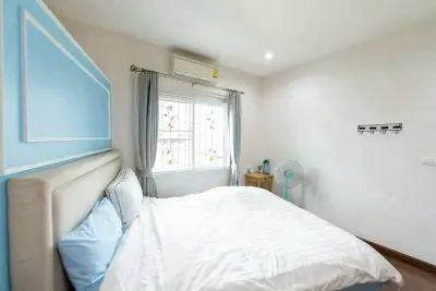 Bright and cozy bedroom with modern decor and natural light