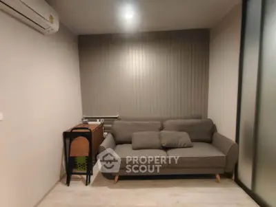 Cozy living room with modern sofa and air conditioning