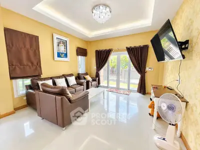 Luxurious living room with elegant decor, plush sofas, and a wall-mounted TV, perfect for relaxation and entertainment.