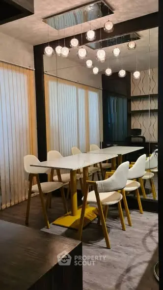 Modern dining room with elegant lighting and stylish furniture