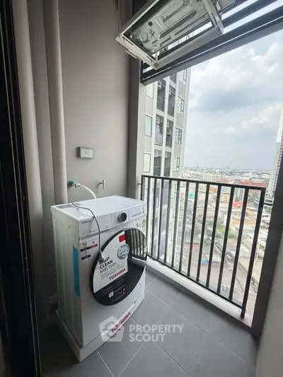 Modern apartment balcony with washing machine and city view