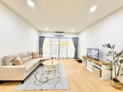 Spacious modern living room with natural light and stylish decor