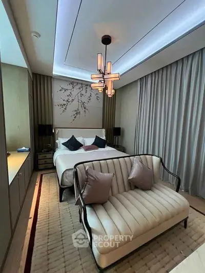 Luxurious bedroom with elegant decor and stylish lighting in modern apartment.